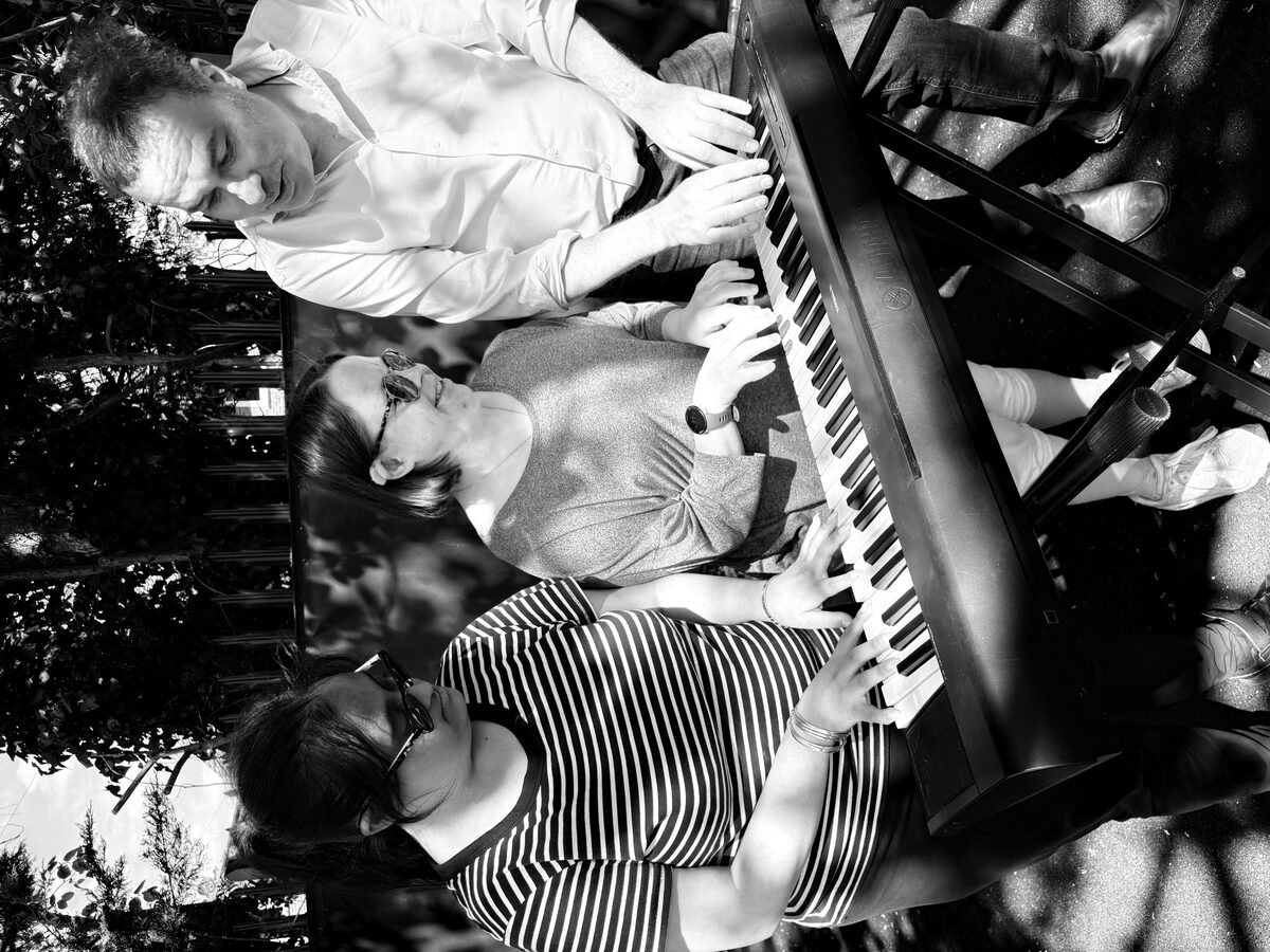 Piano session - students and instructor at keyboard